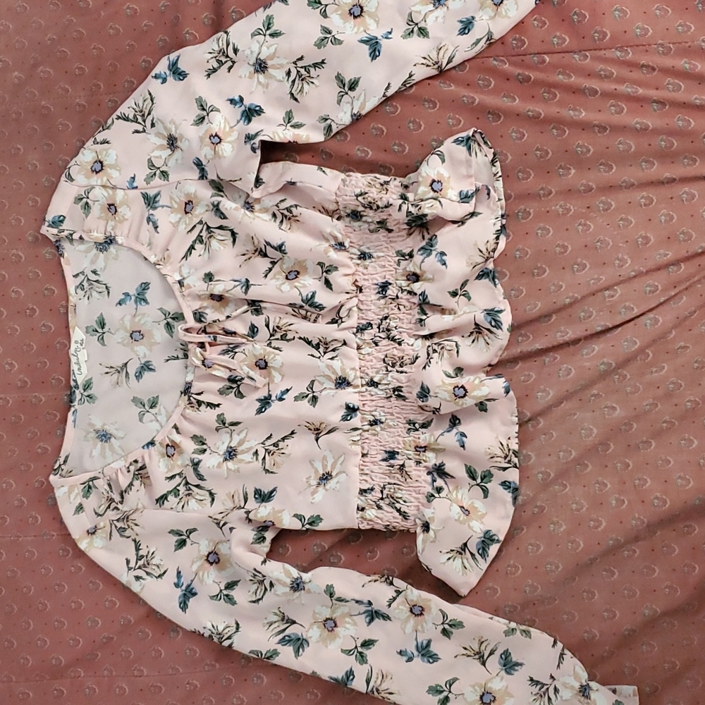 A pink top with white/blue flowers